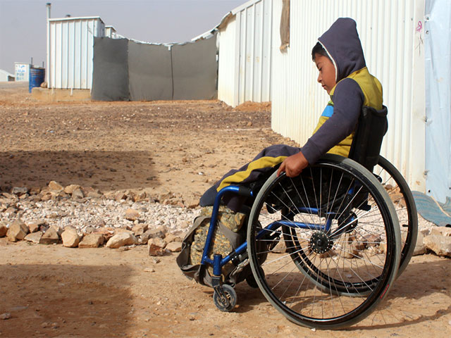 Ahmad gets out and about at Azraq refugee camp. Jordan.