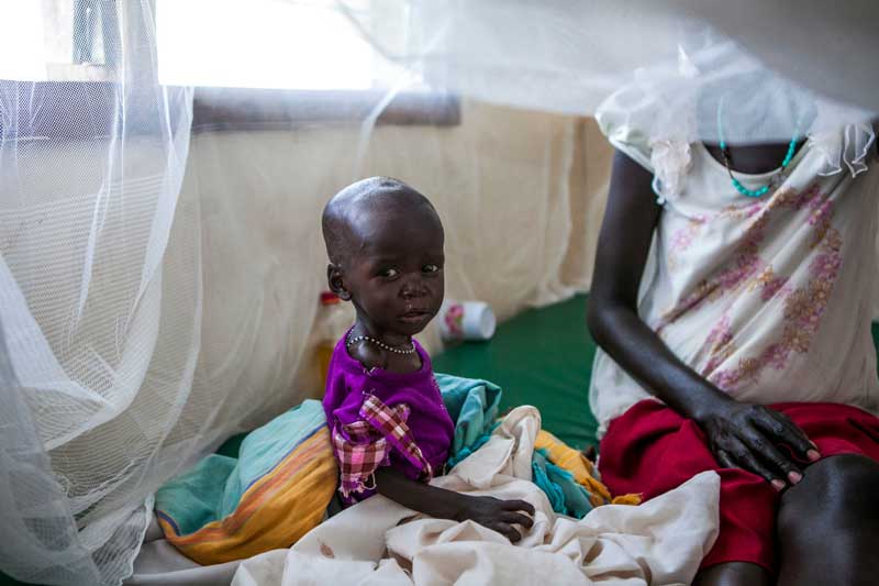 Agnes recovering in bed in Kakuma camp