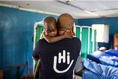 Simon Njenga, HI occupational therapist, during a rehabilitation session with Elizabeth at a Rehabilitation Center Kakuma, Kenya