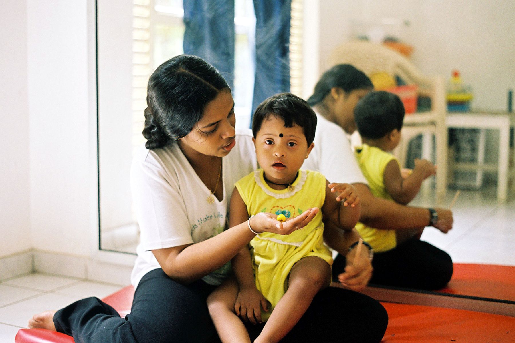 A child with Down syndrome in Sri Lanka receives rehabilitation support.