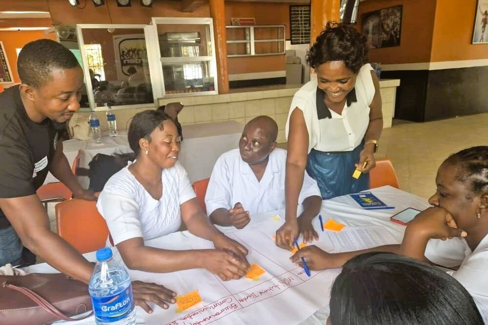 Healthcare workers completing HI training on disability inclusive care