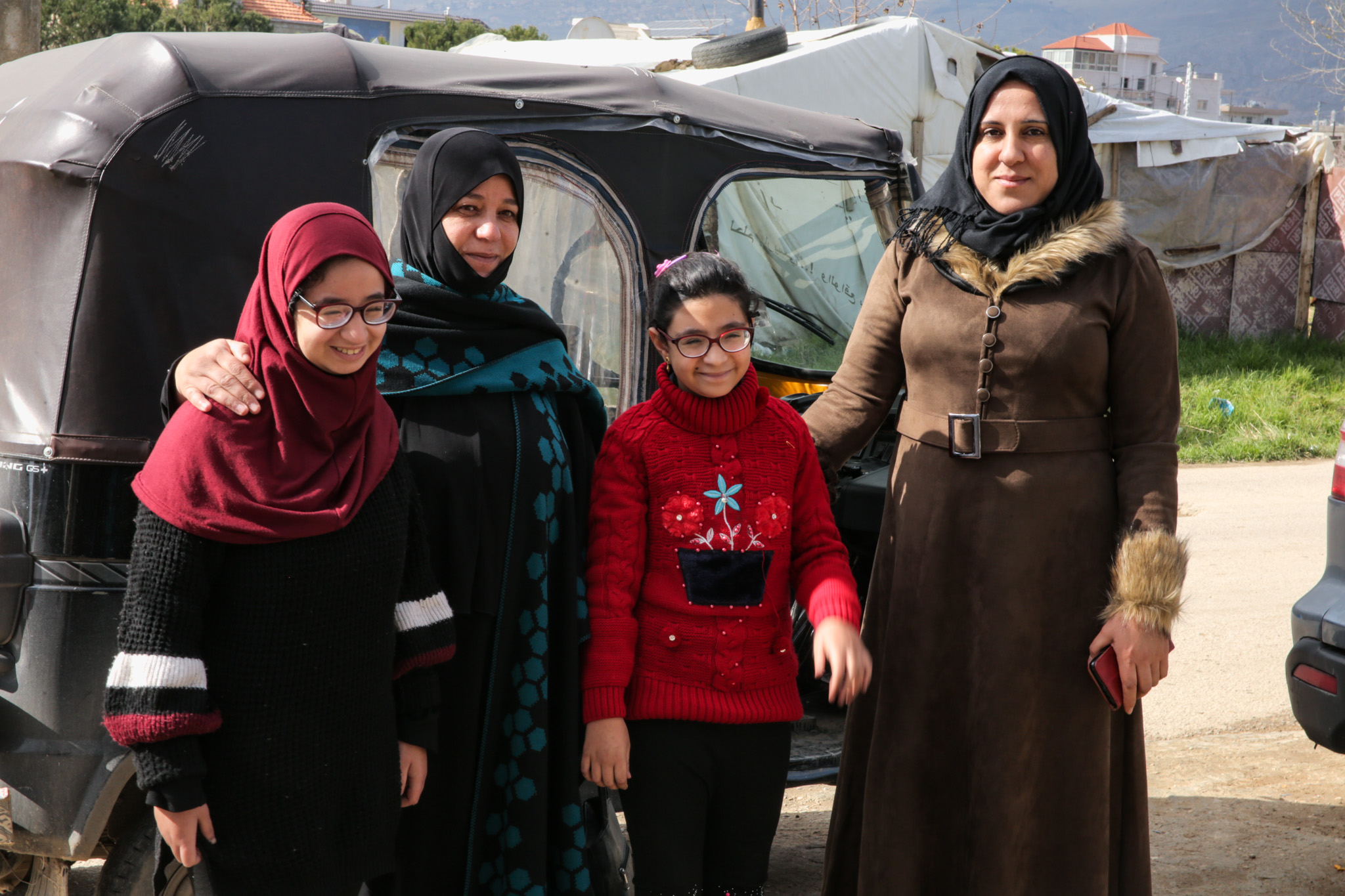 Aicha and Hoda together with some of their children after a rehabilitation session at the Mousawat centre 