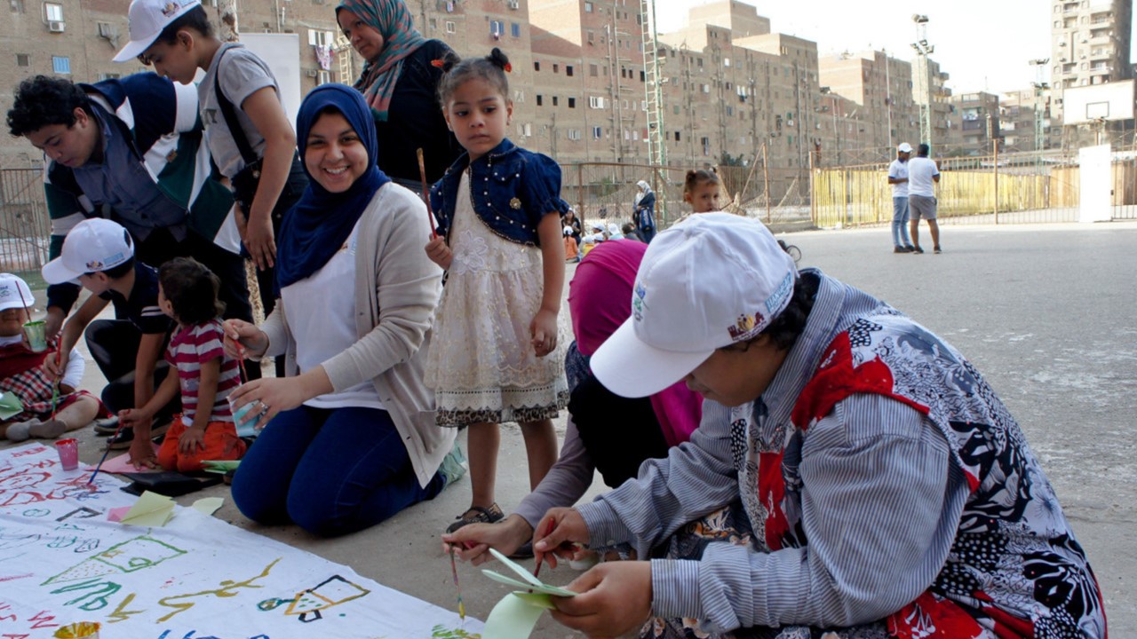 Children drawing a banner