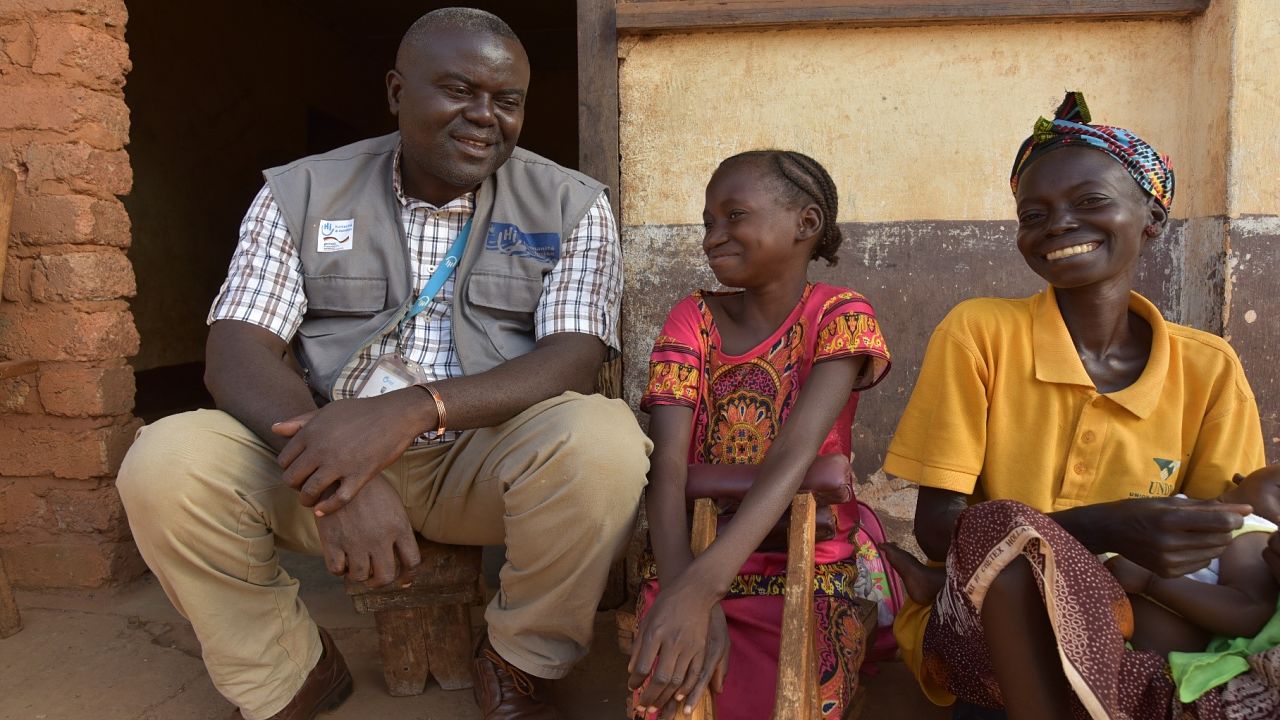 An HI physiotherapist works with a young patient in Bambari