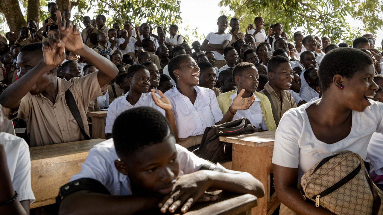 Students burst out laughing during a participatory theater performance by the association Nyagbe (