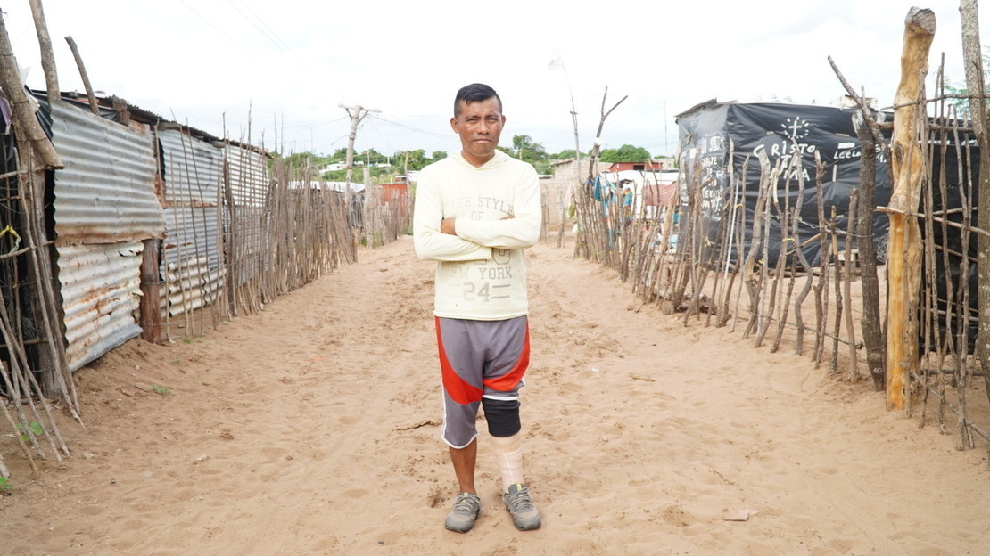 Atilio outside his home in the informal settlement in Maicao, November 2021