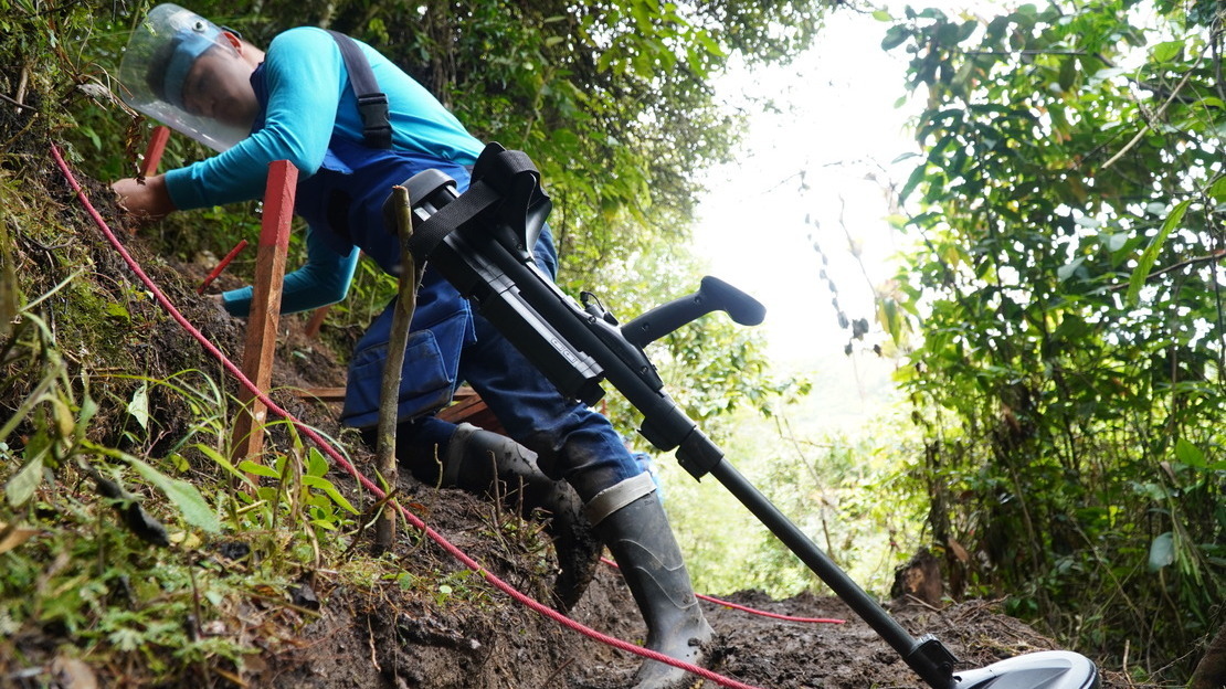 A deminer working in the Chaparral area, where teams have to cope with regular flooding, rockslides and landslides.