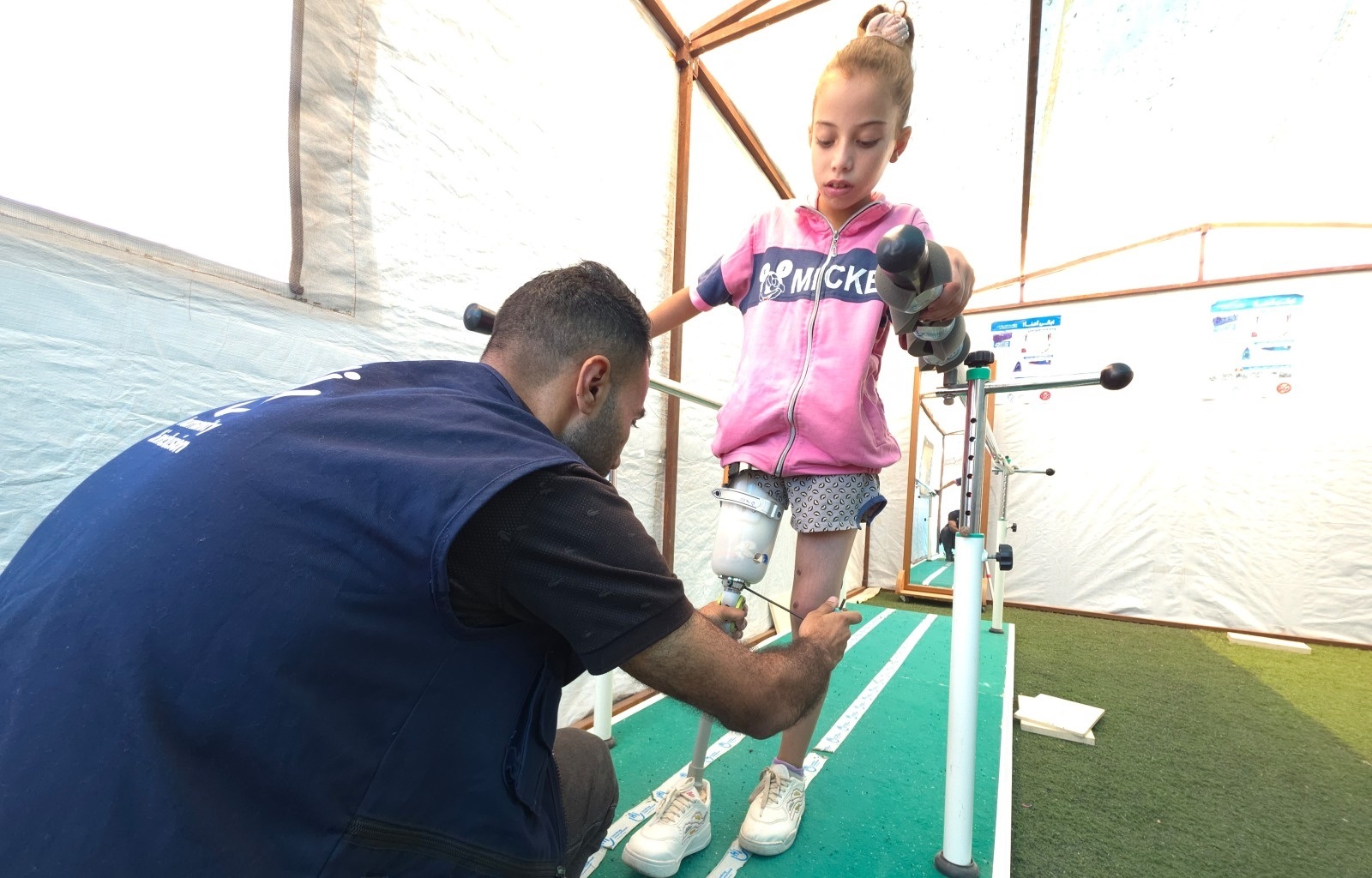 Malak, 9, walks with her new articial leg