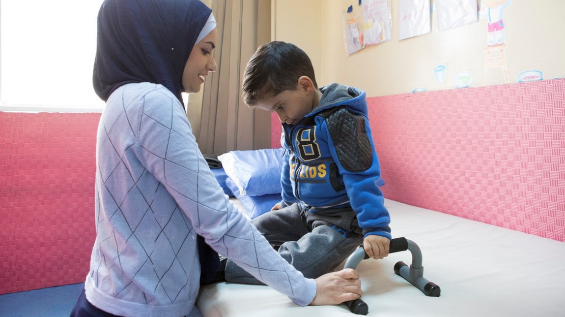 Mohammad, who has spina bifida, performs his rehabilitation exercises 