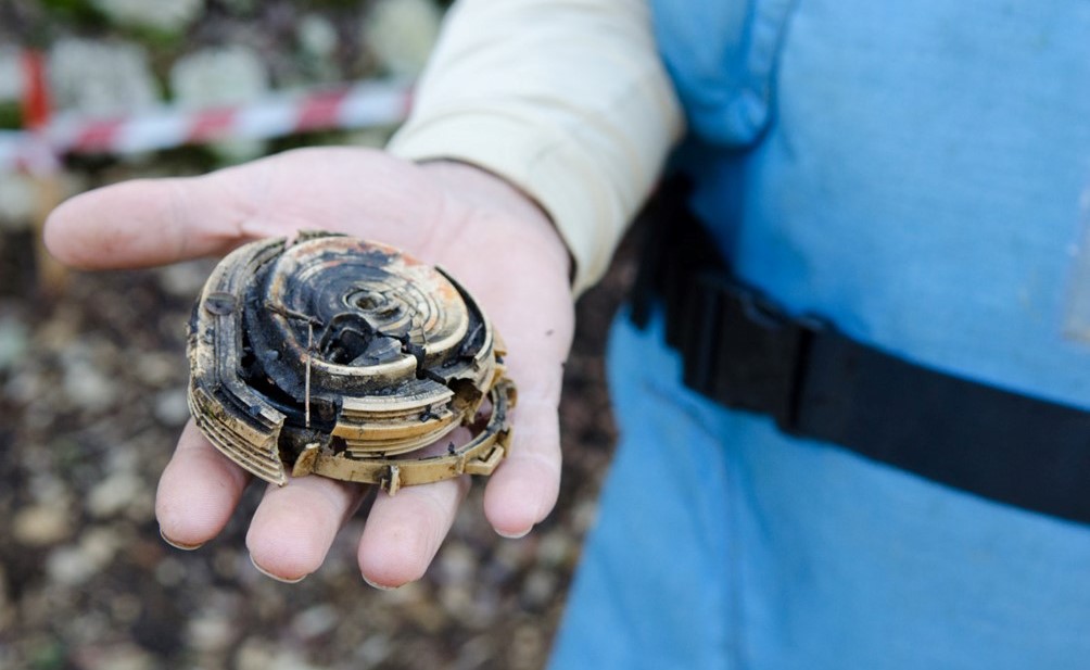 A destroyed mine in the hand of a HI clearance expert in Lebanon. 
