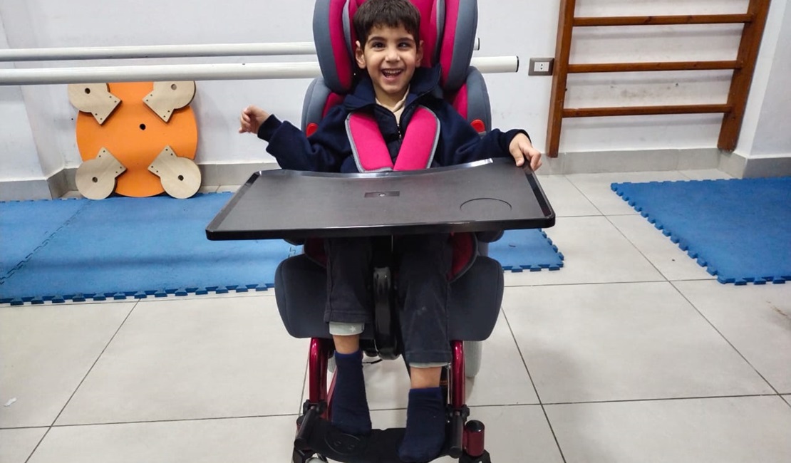 Mohammed in his new wheelchair, adapted ot his disability. 