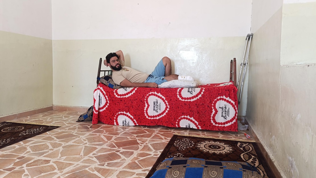 Osama at home after his amputation