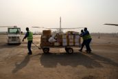 HI workers prepare cargo at M'Poko international airport ; }}