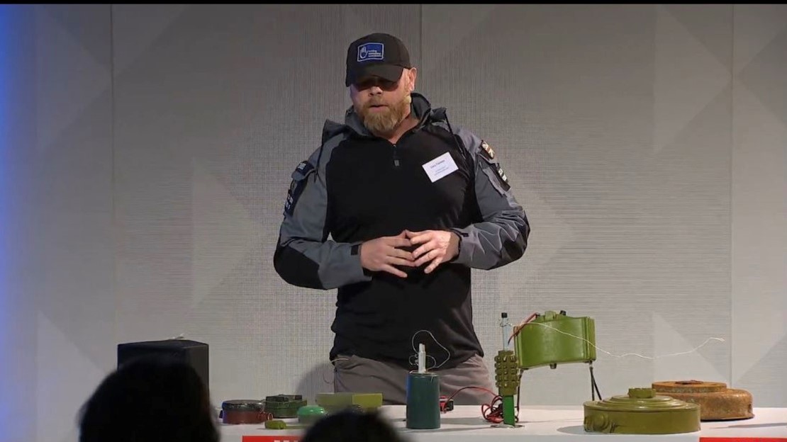 Gary Toombs shows some explosive devices during an event in Berlin