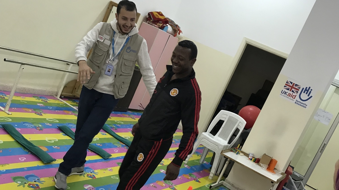 Amer does balance exercices with an HI physiotherapist.