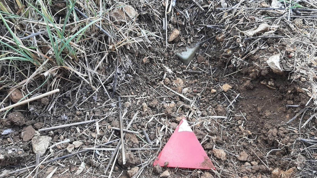 Israeli landmine found in the village of Btater in the Aley district of Lebanon and marked with a red triangle by the HI demining team. 