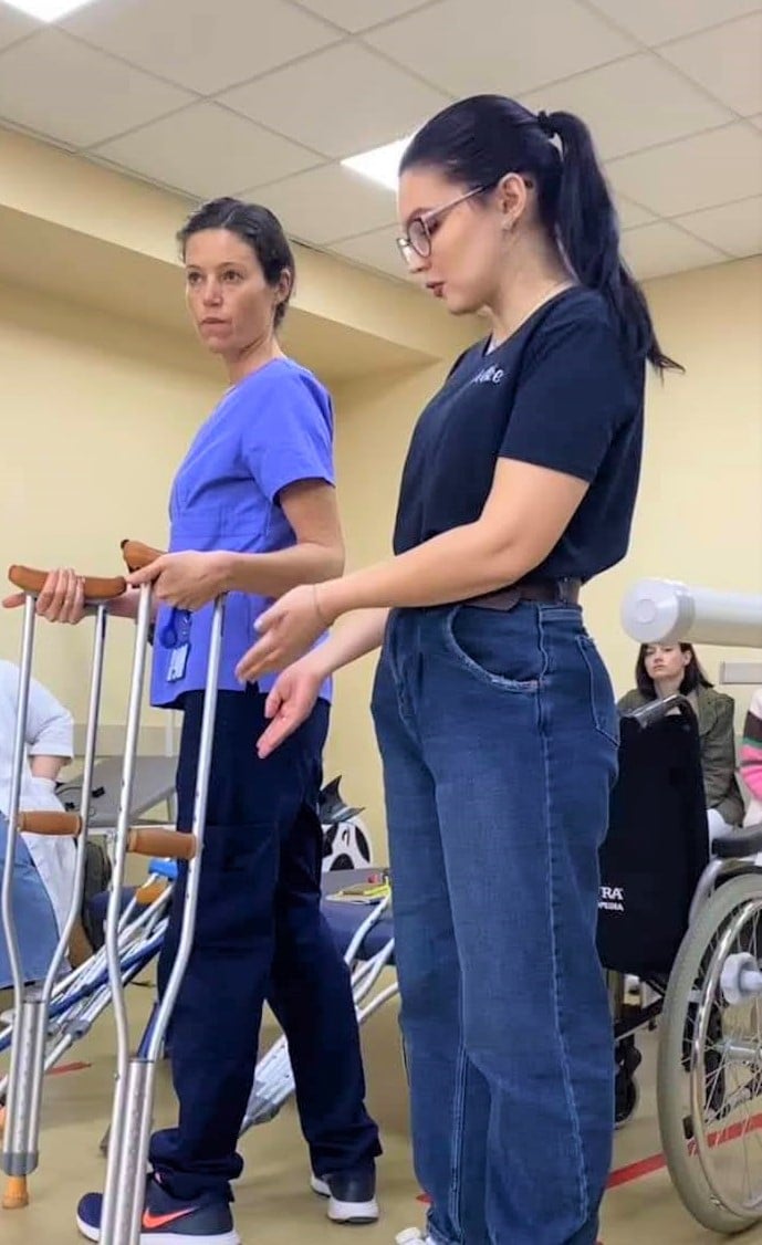 HI rehabilitation specialist, Gaëlle (left) in a hospital in Dnipro Ukraine.