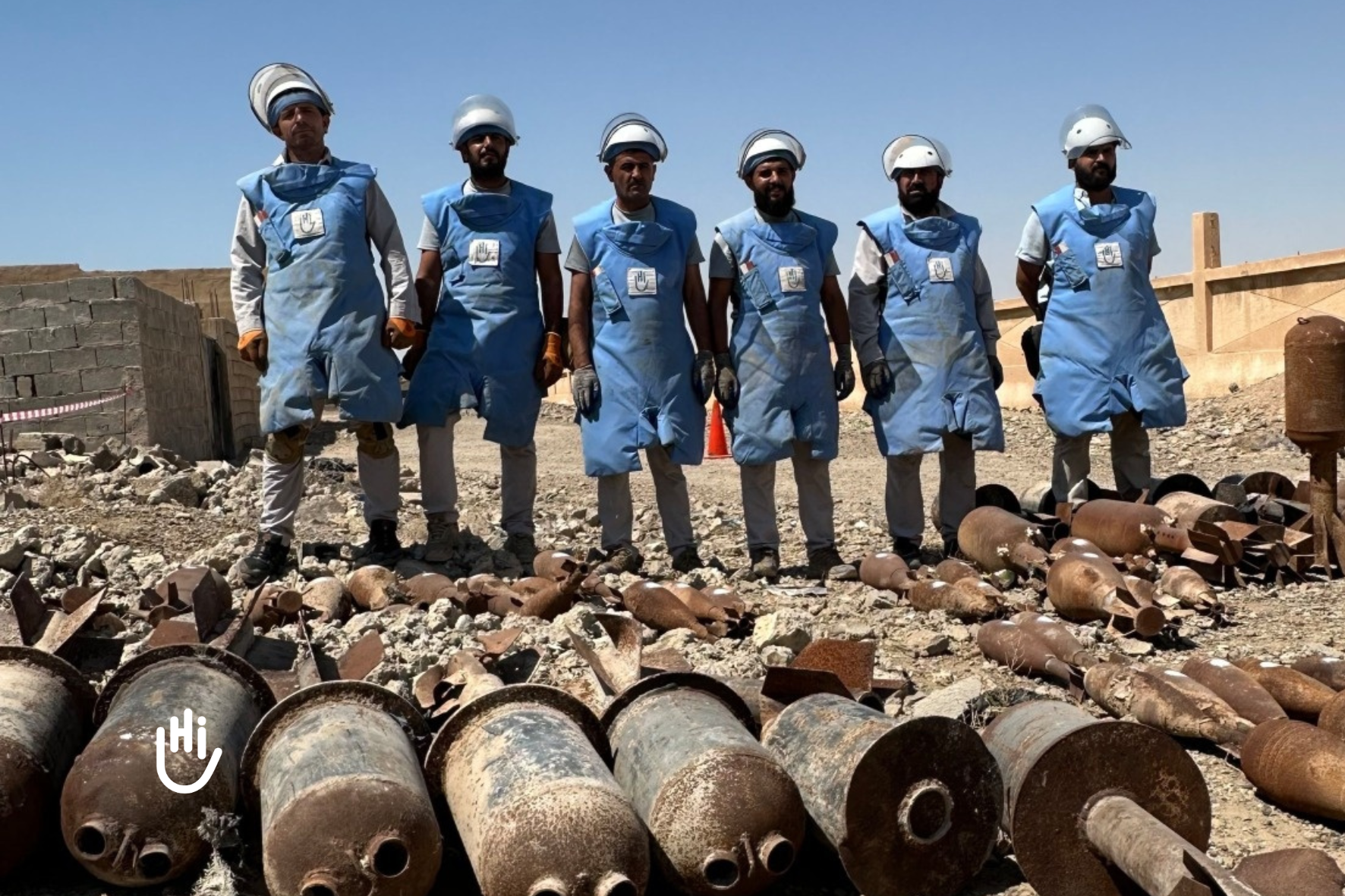 Team of deminers in Syria, in front of unexploded bombs. All items have been safely removed to a secure storage area to await demolition. August 2025