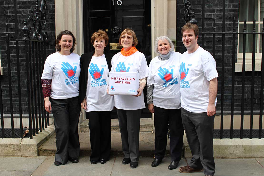 Soroptimists and HI staff hand in our No More VIctims petition to 10 Downing Street in 2015