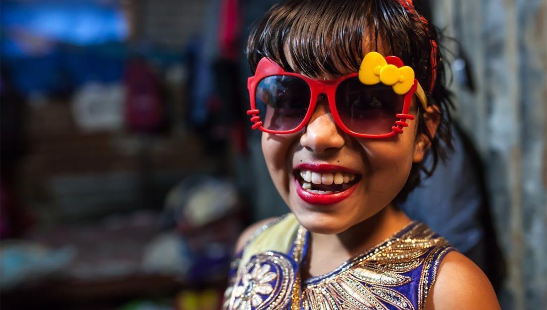 Nirmala, a young amputee, wearing sunglasses, Nepal/