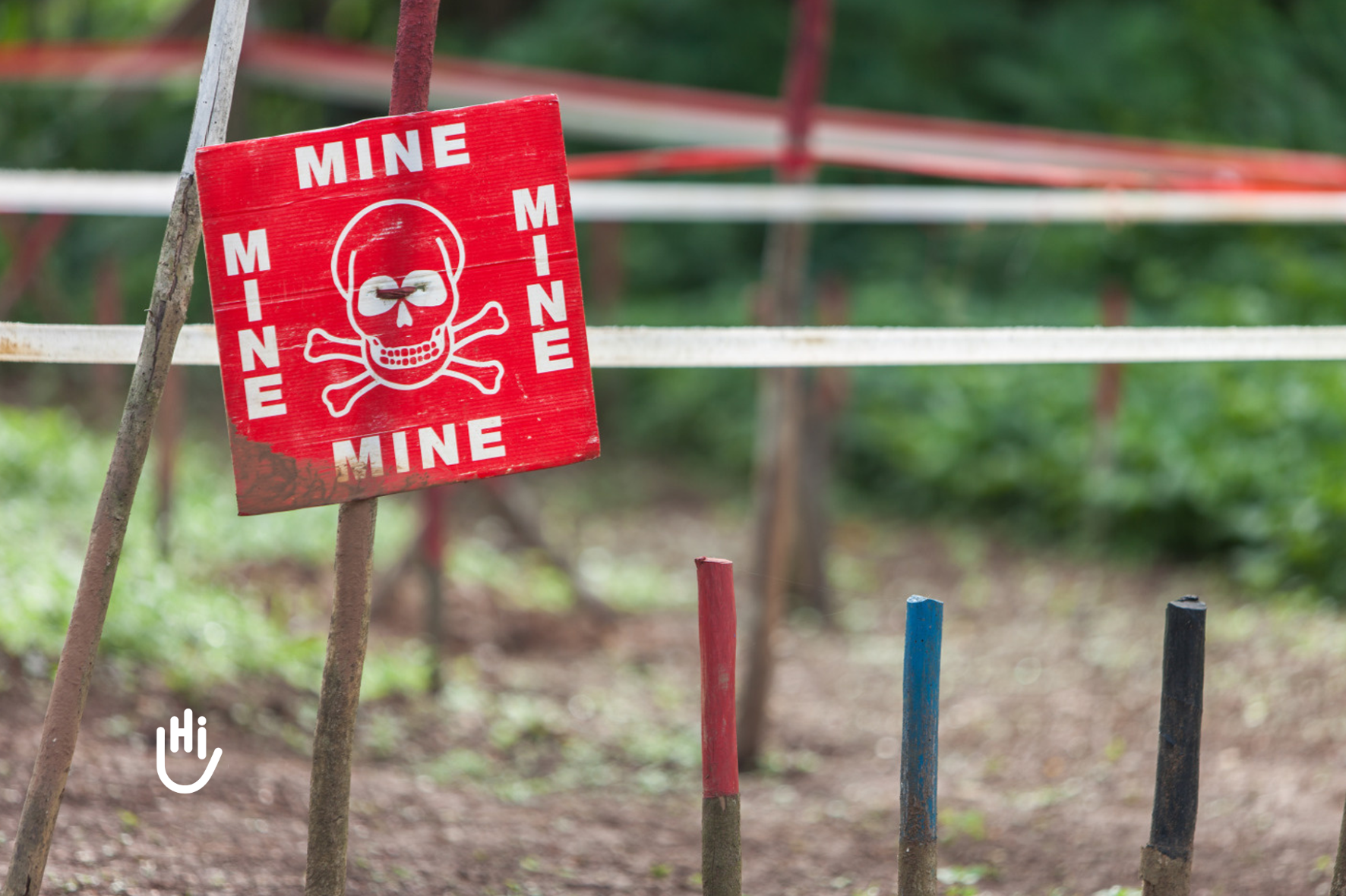 A mine sign in a minefield that it's been cleared by HI teams in RDC, 2017. © Brice Blondel/HI