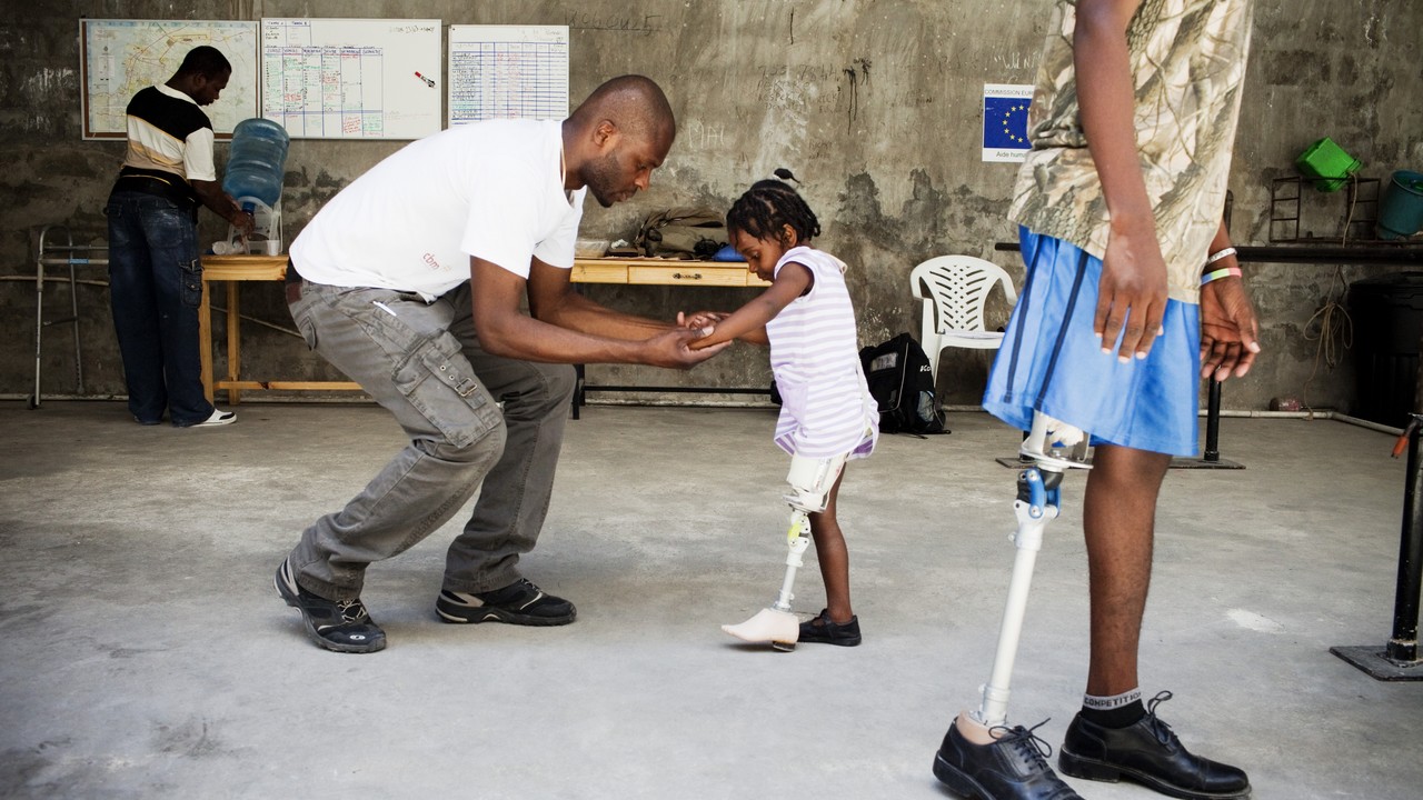 Fymee learning to walk again on her new artificial leg, Port-au-Prince, Haiti.