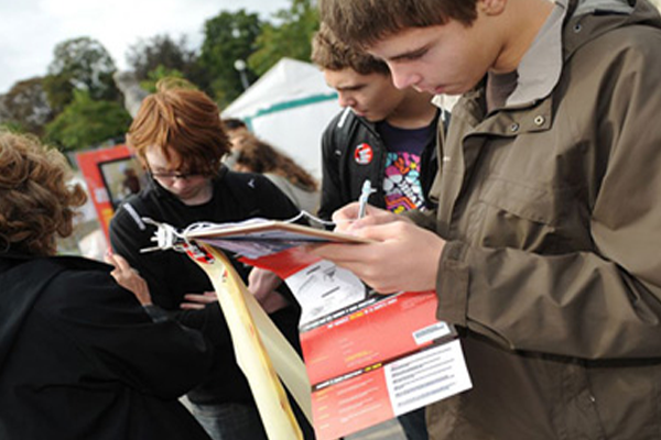 Students collecting signatures at their school