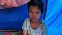 Chid affected by tsunami and earthquake which hit Sulawesi, Indonesia in September 2019.; }}