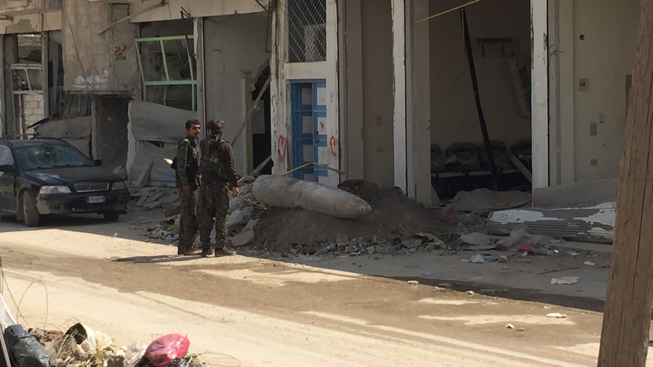 An explosive remnant of war (ERW)found on the street in Kobani, Syria.; }}