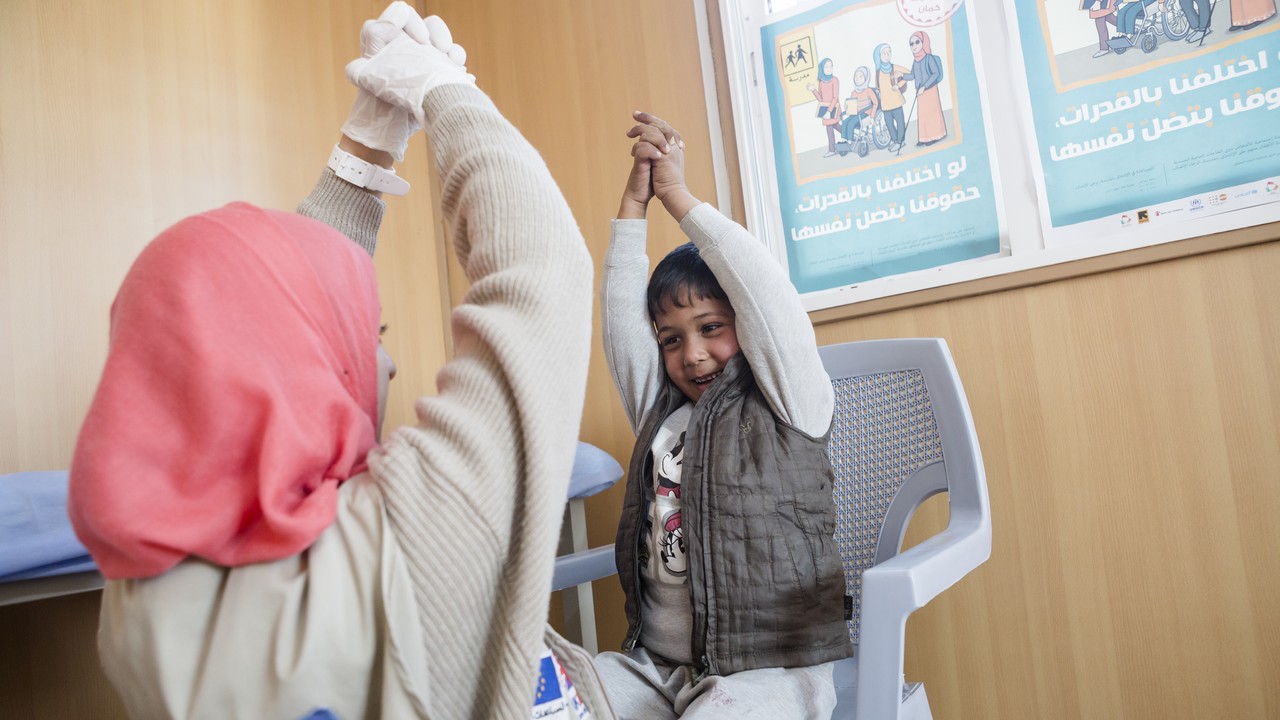 Five -year-old Noor lives in the Azraq refugee camp in northern Jordan. Since his birth, Noor has had paralysis in his right arm caused by nerve damage. With rehabilitation Noor will be able to gain mobility in his arm and he now has regular physiotherapy sessions to strengthen his arm with Handicap International physiotherapist, Asala.; }}