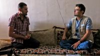 Shwan, a member of Handicap International’s team, listens to Abdelillah during a psychosocial support session. ; }}