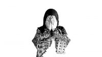 A Syrian woman holds her head in her hands; }}