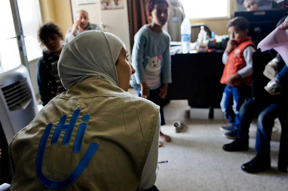 Noor, our physiotherapist, talking to patients at HI's P&O workshop in Mafraq, Jordan.