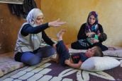  Mariam delivering a rehabilitation session to Fayez, a 3 year-old boy,  in the Bekaa Valley, Lebanon.; }}