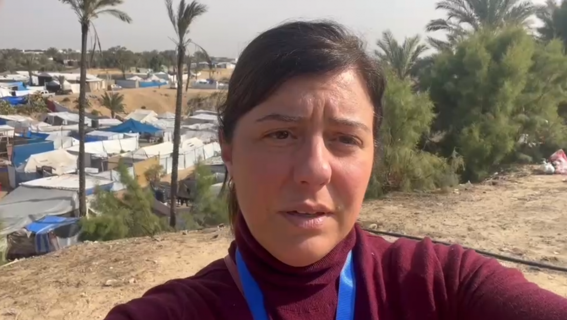 Mara Bernasconi in front of a settlement camp in Khan Yunis, Gaza