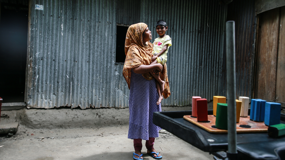 Sokhina, 33,  in front of her house, holding her daughter Rozina, 7, who has cerebral palsy                 Sokhina, 33,  in front of her house, holding her daughter Rozina, 7, who has cerebral palsy     Sokhina hold her daughter in her hands            ; }}