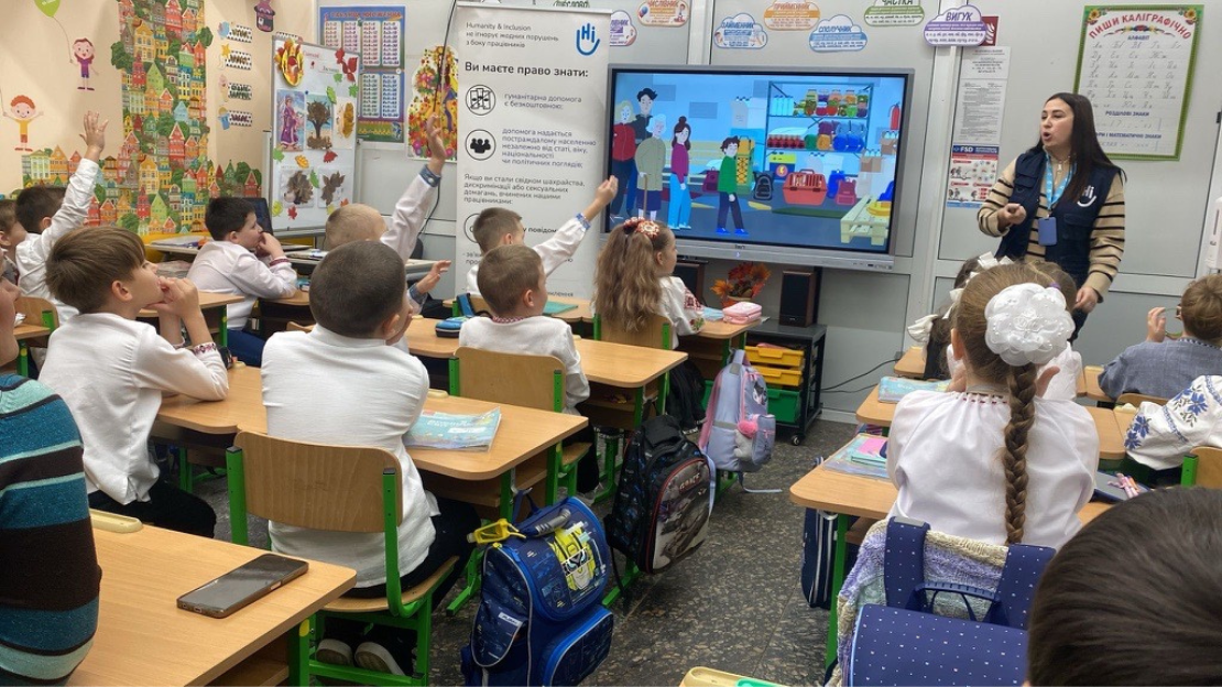 Ana Peteris (HI) is teaching children about the dangers of explosive ordnance in an underground school in Kharkiv city. M. Monier / HI 2024; }}
