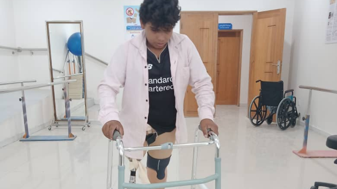 Hussein had both legs torn apart by a landmine. HI supports him to walk again