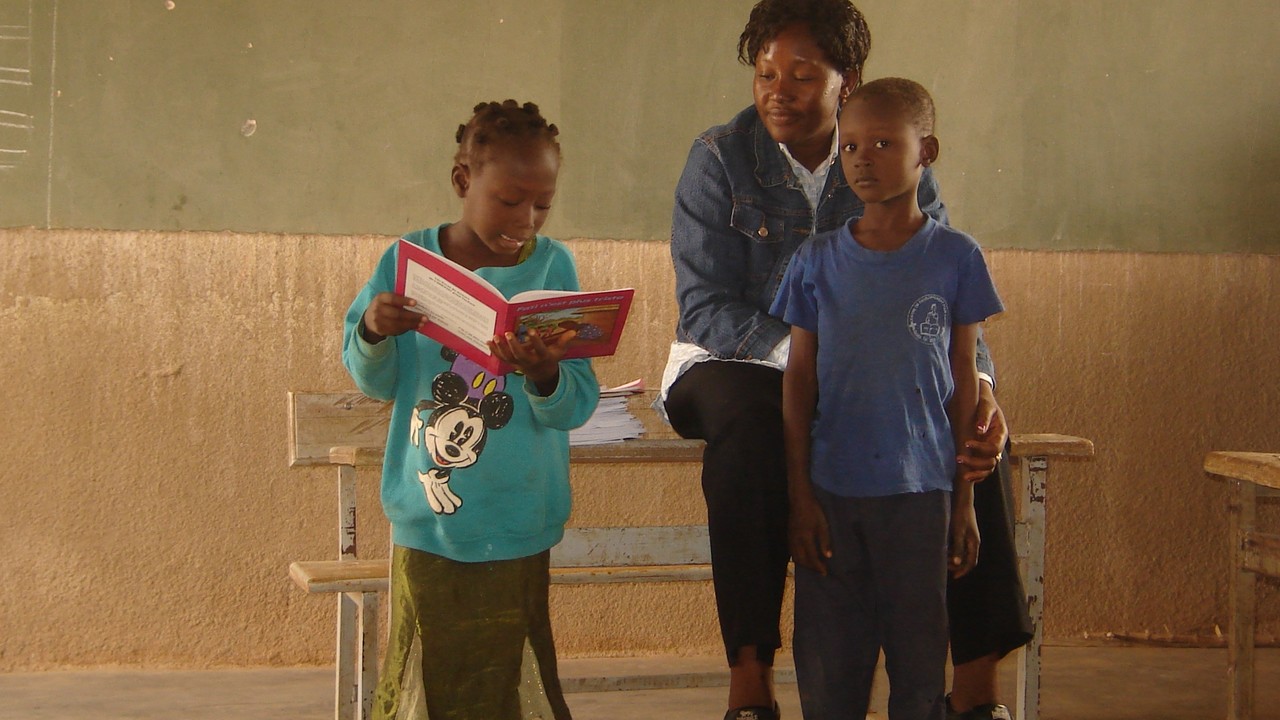 Estelle Koudougou, Handicap International's Inclusive Education project manager in Burkina Faso with two children.; }}
