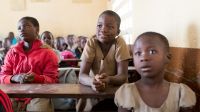 Moussifa, 9 (centre), in a French-language lesson with her second-year primary school class ; }}