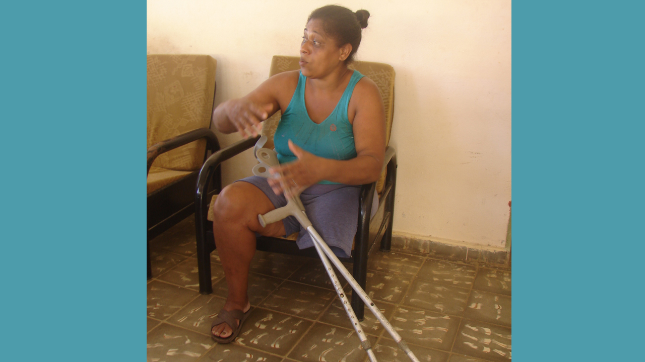 Maria Del Carmen, affected by hurricane Matthew in Cuba; }}
