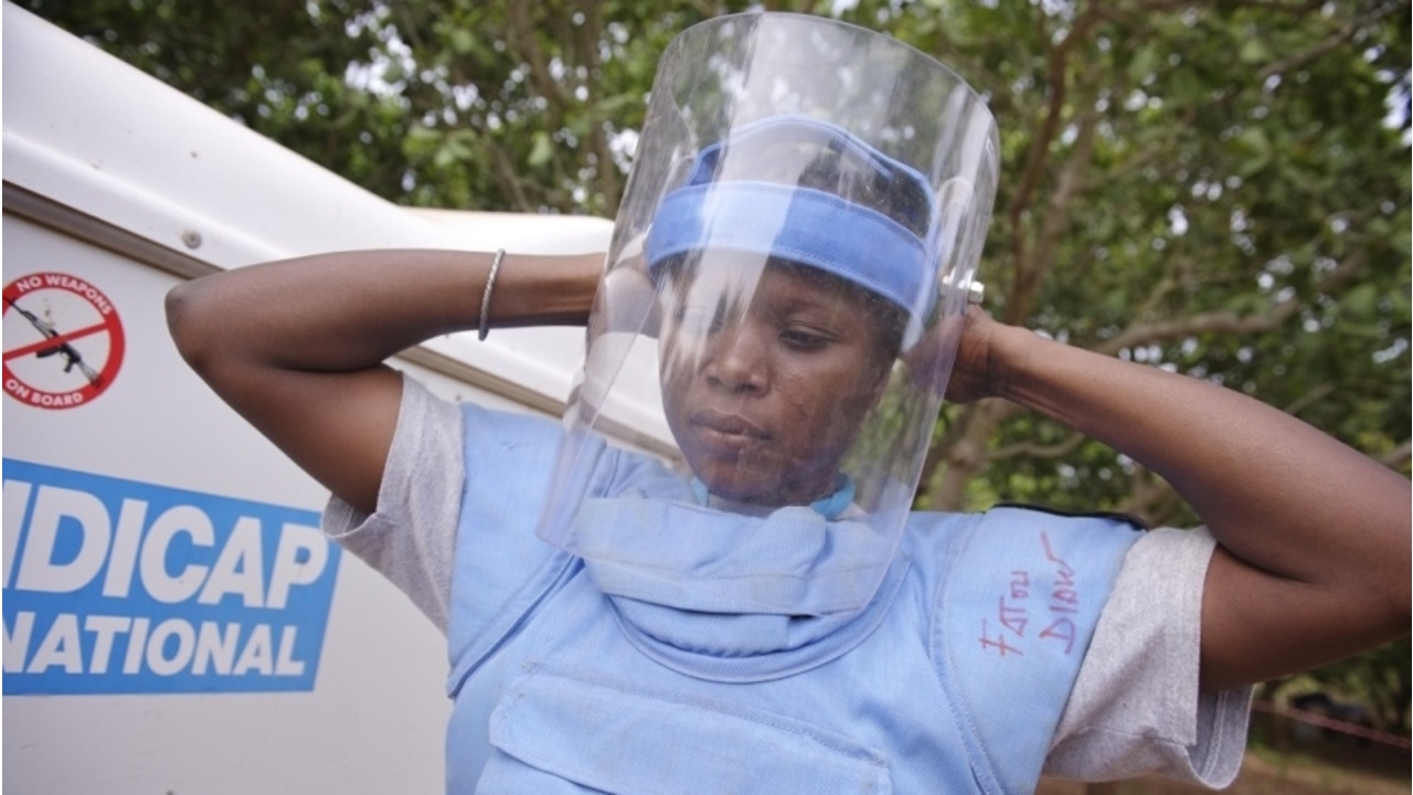 Deminer Fatou Diaw getting ready for a demining session.; }}