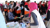 A Handicap International information stand on Mine Action Awareness Day with information to protect people from the dangers of unexploded weapons. Gaza.; }}