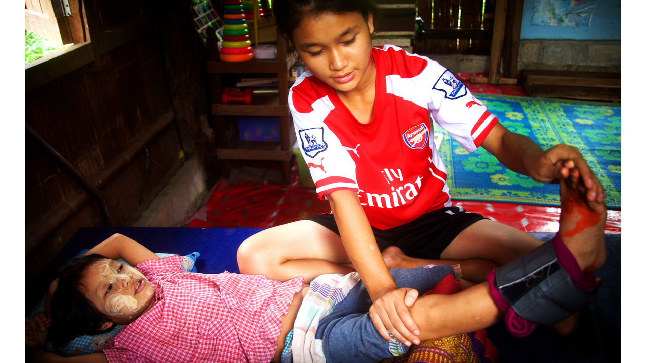 Hae Tar in Handicap International’s rehabilitation centre. ‘It’s a good thing that she exercises, but often I worry she’ll fall down’, her sister says. ; }}