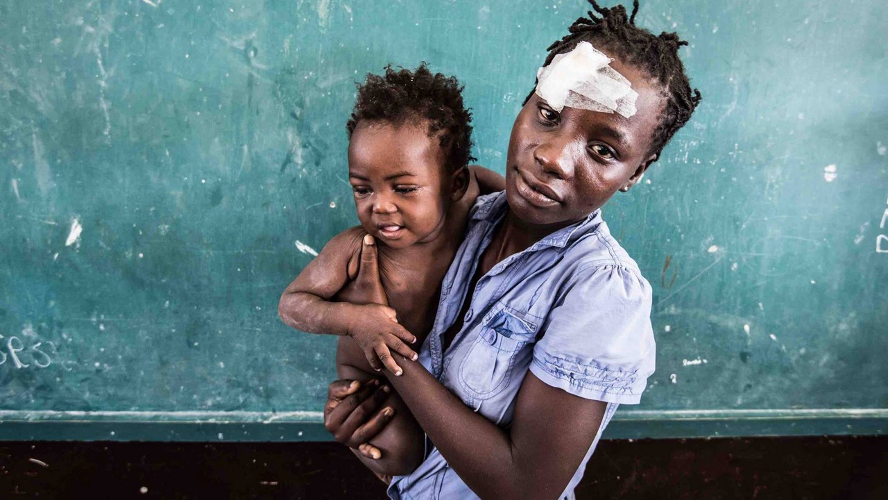 Andrénise Pierre, 20, mother of Donaldson, almost died when Hurricane Matthew devastated the city of Les Cayes.; }}