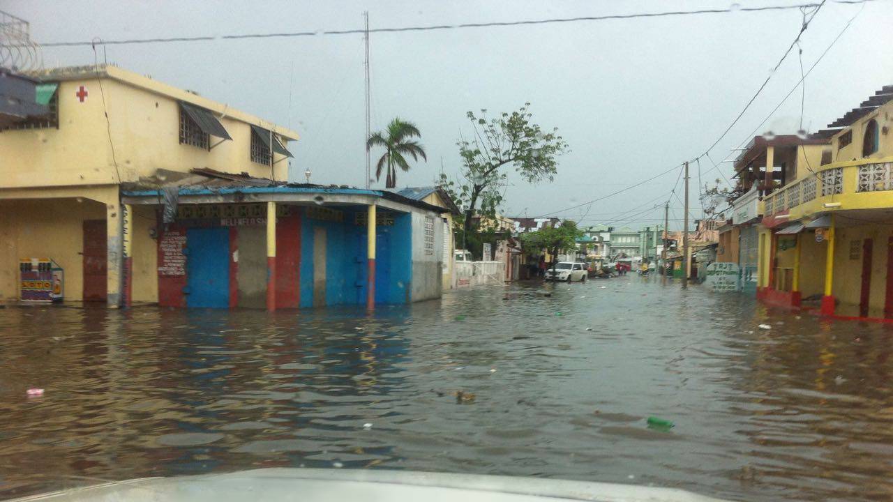 Street in Les Cayes flooded by rain on 20th October 2016.; }}