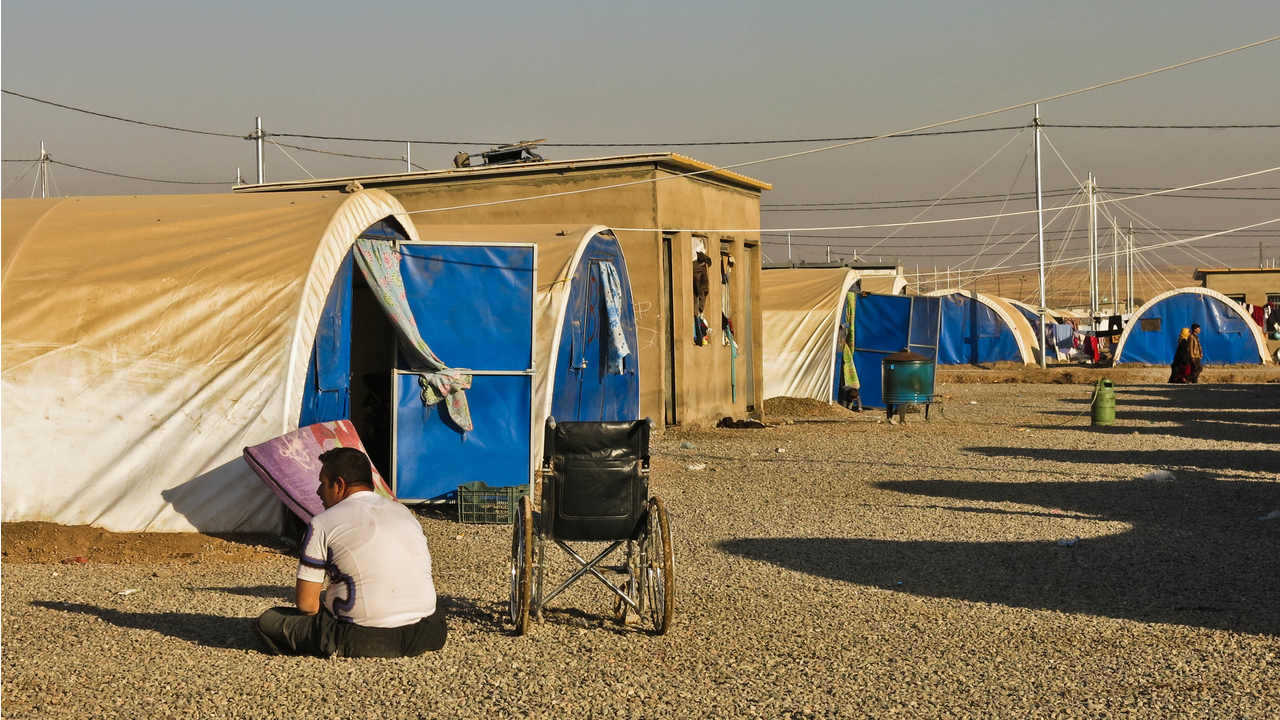 A disabled man, in Khazer IDP camp. ; }}