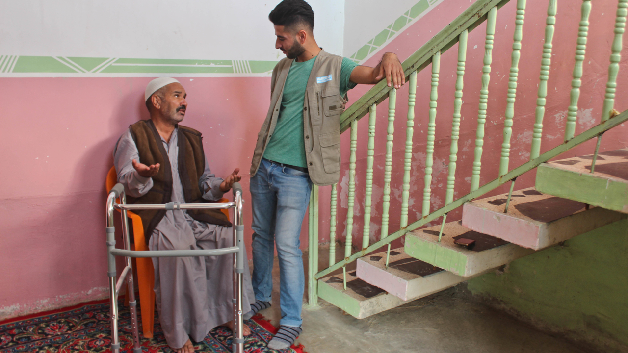 Shvan and Salim chat at the end of the physiotherapy session.; }}