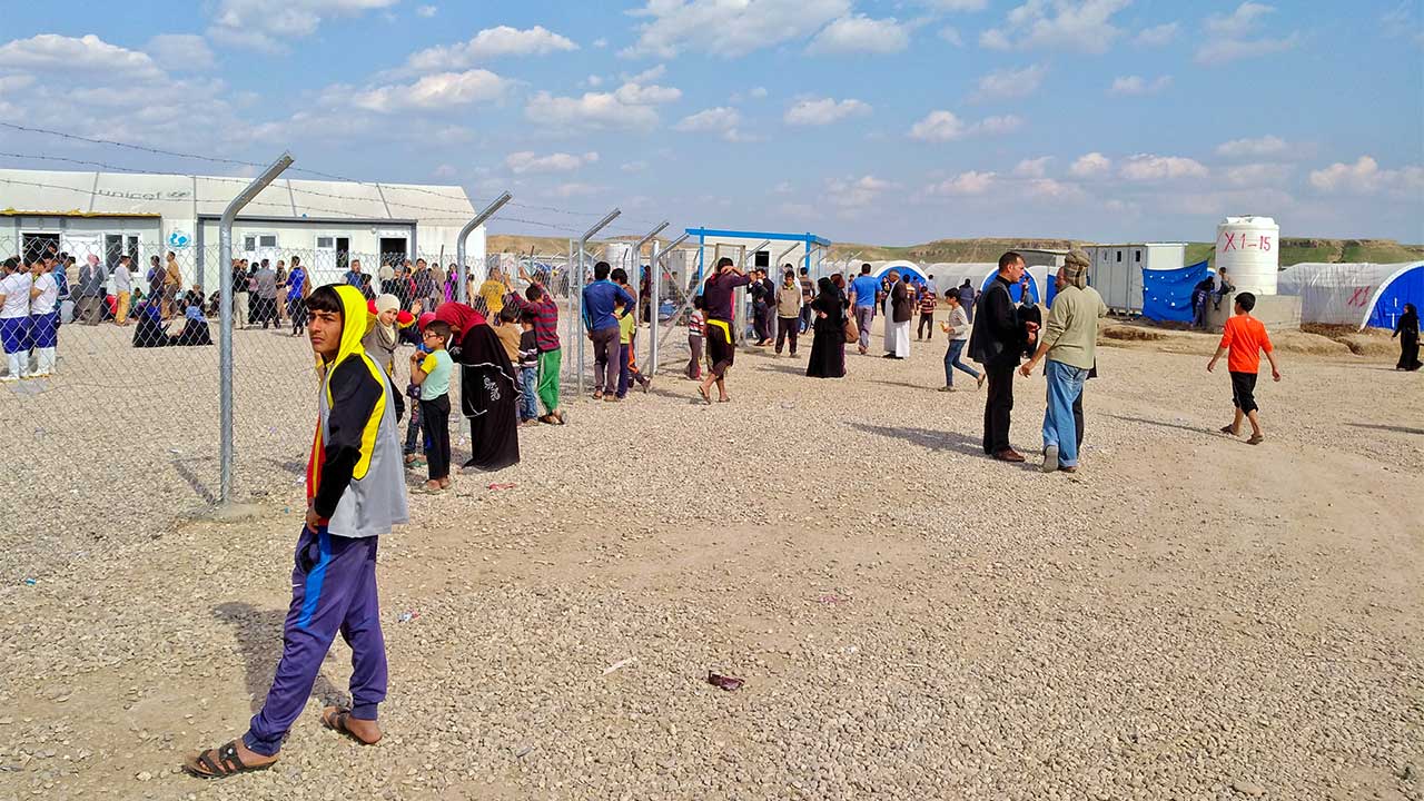 Iraqis in a camp for internally displaced people; }}