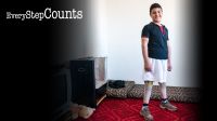 Qusay standing tall on his new prosthetic legs, Jordan; }}